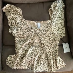 Size large New with tags light pink top with black flowers